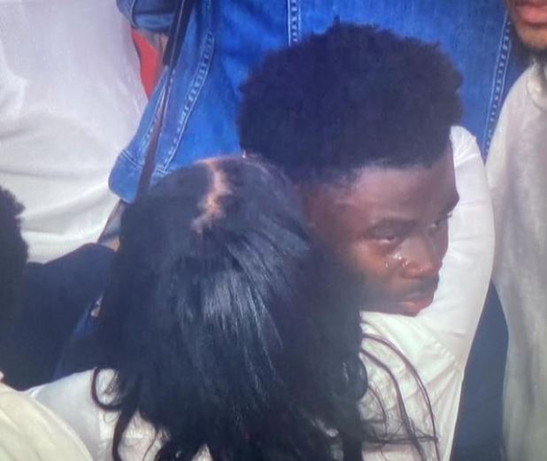 Yomi Saka wife hugging their son Bukayo Saka after the match